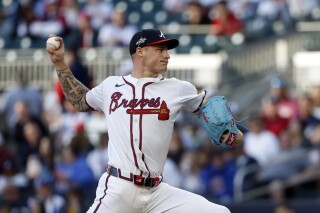 Atlanta Braves pitcher AJ Smith-Shawver throws during the first inning of a baseball game against the Cincinnati Reds, Monday, May 5, 2025, in Atlanta. (AP Photo/Butch Dill)