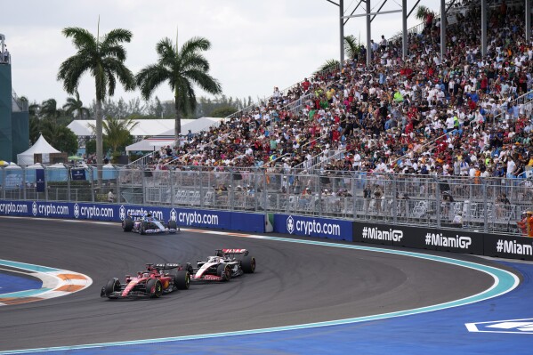 FILE - Charles Leclerc leads Kevin Magnussen and Esteban Ocon during the Formula One Miami Grand Prix auto race at the Miami International Autodrome, Sunday, May 7, 2023, in Miami Gardens, Fla. Miami and Shanghai will host their first Formula One sprint races next season as two of the six sprints on the calendar take place in the United States. The calendar published Tuesday includes the first sprint race of the season in April at the Chinese Grand Prix. (AP Photo/Rebecca Blackwell, File)