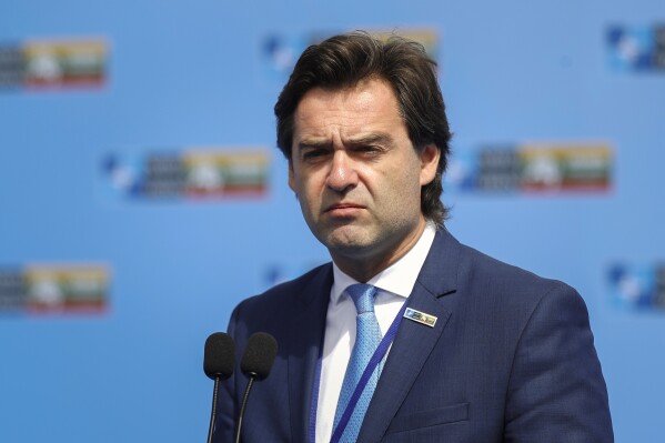FILE - Moldova's Foreign Minister Nicu Popescu addresses the media at the NATO summit in Vilnius, Lithuania, on July 11, 2023. Moldova's foreign minister Nicu Popescu announced on Wednesday, Jan. 24, 2024, that he's resigning from his post, saying that he 