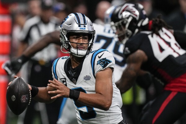 Carolina Panthers quarterback Bryce Young (9) works in the pocket against the Atlanta Falcons during the first half of an NFL football game, Sunday, Sept. 10, 2023, in Atlanta. (AP Photo/John Bazemore)