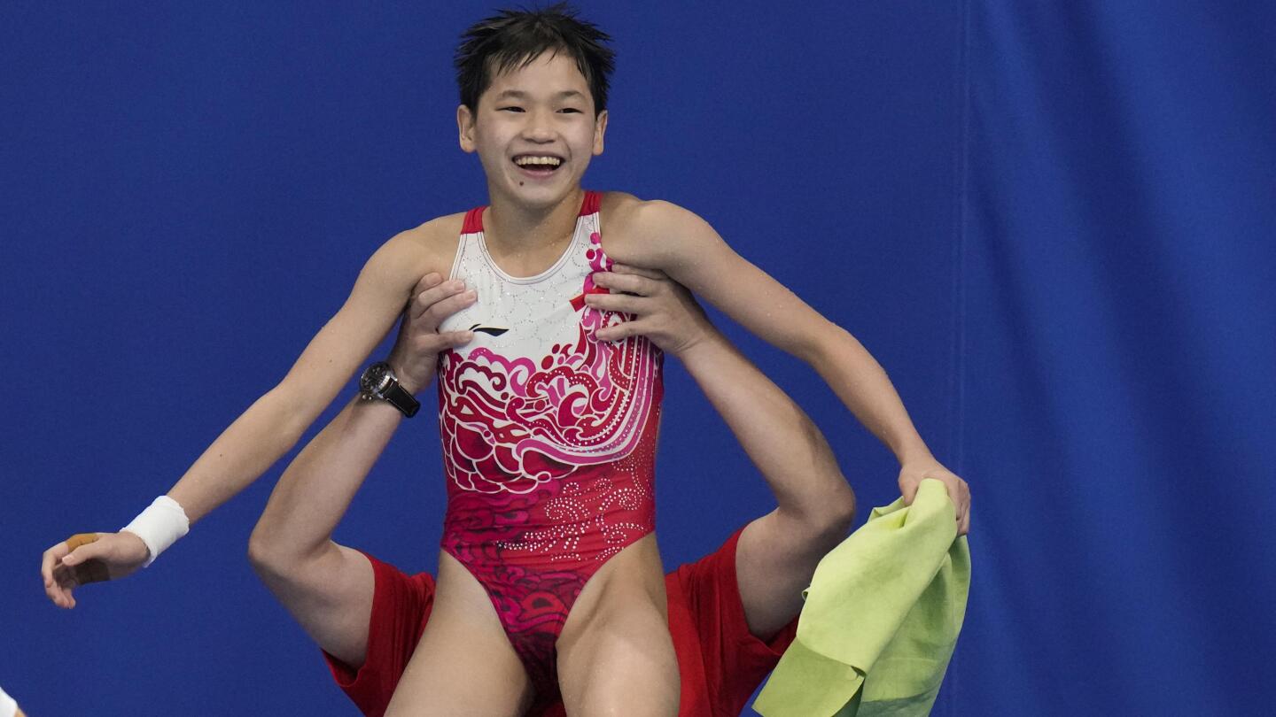 Perfect 10s China's Quan dominates for Olympic diving gold AP News