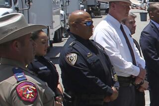 In this May 26, 2022, photo, Uvalde School Police Chief Pete Arredondo, third from left, stands during a news conference outside of the Robb Elementary school in Uvalde, Texas. Facing massive public pressure, Uvalde’s top school official has recommended the firing of the school district police chief who was central to the botched law enforcement response to the shooting at an elementary school that killed two teachers and 19 students.
The city’s school board will consider firing  Arrendondo at a special meeting Saturday, July 23, to consider the superintendent's recommendation. (AP Photo/Dario Lopez-Mills, FILE)