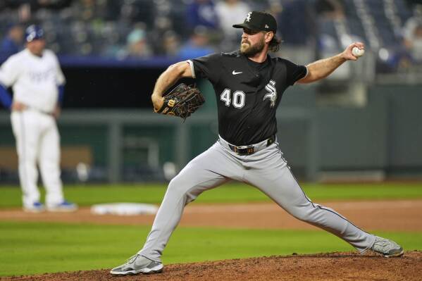 Chicago White Sox relief pitcher Tyler Gilbert throws during the seventh inning of a baseball game against the Kansas City Royals, Wednesday, May 7, 2025, in Kansas City, Mo. (AP Photo/Charlie Riedel)