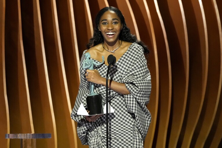 Ayo Edebiri accepts the award for outstanding performance by a female actor in a comedy series for "The Bear" during the 30th annual Screen Actors Guild Awards on Saturday, Feb. 24, 2024, at the Shrine Auditorium in Los Angeles. (AP Photo/Chris Pizzello)