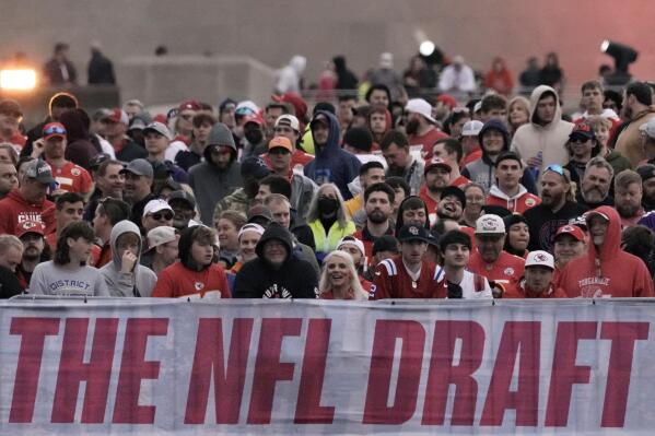 Fans wait for the start of the second round of the NFL football draft, Friday, April 28, 2023, in Kansas City, Mo. (AP Photo/Charlie Riedel)