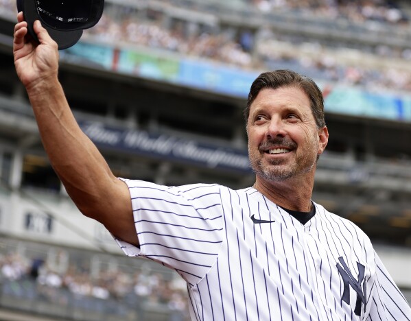 FILE - Former New York Yankees player Tino Martinez waves during the Yankees' Old-Timers' Day ceremony before a baseball game against the Milwaukee Brewers, Sept. 9, 2023, in New York. Martinez, former Met Howard Johnson and Fordham women's basketball career scoring and rebounding leader Anne Gregory-O’Connell were honored with Thurman Munson Awards, Thursday, March 14, 2024, at the AHRC New York City Foundation's annual dinner. (AP Photo/Adam Hunger, File)