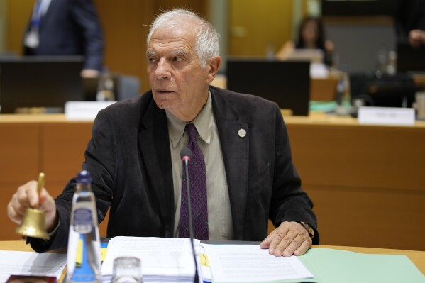 European Union foreign policy chief Josep Borrell rings a bell to signify the start of a meeting of EU foreign ministers at the European Council building in Brussels, Monday, Nov. 13, 2023. European Union foreign ministers gather Monday to discuss the war in Ukraine and the situation in Israel and Gaza. (AP Photo/Virginia Mayo)