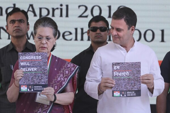 
              United Progressive Alliance Chairperson Sonia Gandhi, left, and Congress Party President Rahul Gandhi, right, release Congress party's manifesto for the upcoming general elections, in New Delhi, India, Tuesday, April 2, 2019. India's general elections are scheduled to be held in seven phases starting from April 11. Votes will be counted on May 23. (AP Photo/Manish Swarup)
            
