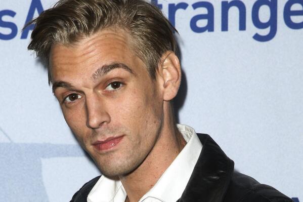 FILE - Singer Aaron Carter arrives at a premiere of "Saints & Strangers" at the Saban Theater in Beverly Hills, Calif., Nov. 9, 2015. Carter, the singer-rapper who began performing as a child and had hit albums starting in his teen years, was found dead Saturday, Nov. 5, 2022, at his home in Southern California. He was 34. (Photo by Rich Fury/Invision/AP, File)