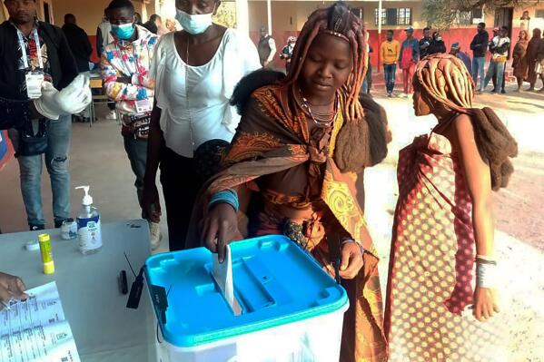 A voter casts her vote at a polling station in Luanda, Wednesday, Aug. 24, 2022. President Joao Lourenco is running for a second five-year term while his party, the Peoples' Movement for the Liberation of Angola, known by its Portuguese acronym MPLA, is campaigning to extend its 47-year run as the country's ruling party. (AP Photo)