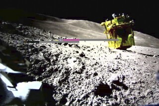 FILE - This image provided by the Japan Aerospace Exploration Agency (JAXA)/Takara Tomy/Sony Group Corporation/Doshisha University shows an image taken by a Lunar Excursion Vehicle 2 (LEV-2) of a robotic moon rover called Smart Lander for Investigating Moon, or SLIM, on the moon. A Japanese moon explorer, after making a historic “pinpoint” lunar landing last month, has also captured data from 10 lunar rocks, a far greater than expected work that could help find the clue to the origin of the moon, its project manager said Wednesday, Feb. 14 , 2024. (JAXA/Takara Tomy/Sony Group Corporation/Doshisha University via AP, File)