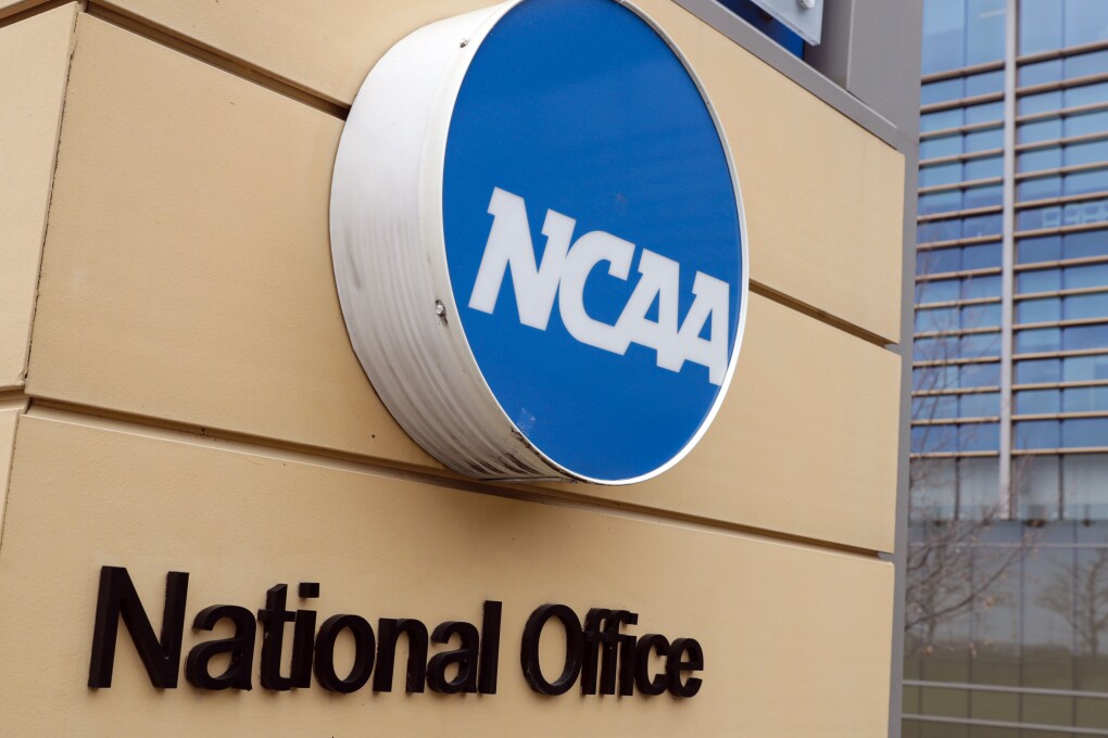 FILE - Signage is on the headquarters of the NCAA in Indianapolis, March 12, 2020. The NCAA and the nation's five biggest conferences have agreed to pay nearly $2.8 billion to settle a host of antitrust claims,a monumental decision that sets the stage for a groundbreaking revenue-sharing model that could start directing millions of dollars directly to athletes as soon as the 2025 fall semester. (AP Photo/Michael Conroy, File)