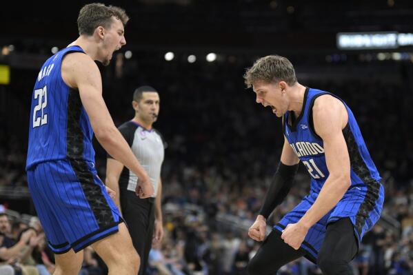 Orlando Magic forward Franz Wagner (22) and center Moritz Wagner (21) celebrate after Moritz Wagner scored and was fouled on the play during the second half of the team's NBA basketball game against the New Orleans Pelicans, Friday, Jan. 20, 2023, in Orlando, Fla. (AP Photo/Phelan M. Ebenhack)