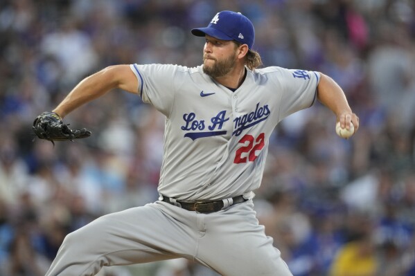 Los Angeles Dodgers starting pitcher Clayton Kershaw works against the Colorado Rockies in the sixth inning of a baseball game Tuesday, June 27, 2023, in Denver. (AP Photo/David Zalubowski)