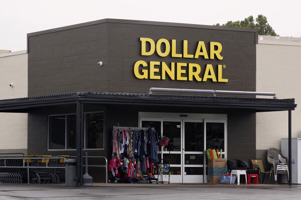 FILE- In this Aug. 3, 2017, file photo the Dollar General store is pictured in Luther, Okla. Shares of Dollar General are up more than 7% before the market open on Friday, Oct. 13, 2023, as Dollar General said that Todd Vasos will be returning to the CEO role at the discount retailer amid concerns of slowing sales growth and claims that its working conditions aren't safe. (AP Photo/Sue Ogrocki, File)