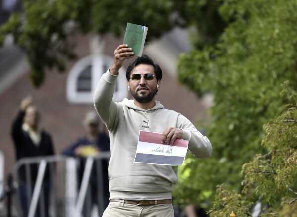 Protestor Salwan Momika appears outside the Iraqi embassy in Stockholm, Thursday, July 20, 2023, where he plans to burn a copy of the Quran and the Iraqi flag. (Oscar Olsson/TT via AP)