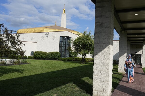 A Mauritanian leave the Islamic Center after a prayer serivce, Friday, July 21, 2023, in Cincinnati. (AP Photo/Darron Cummings)