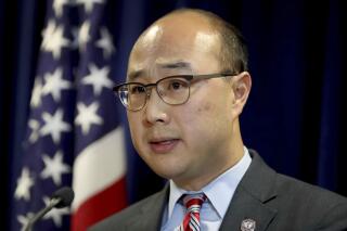 FILE-- In this Nov. 2016, file photo, Ramsey County Attorney John Choi speaks in St. Paul, Minn. Choi is announcing on Wednesday, Sept. 8, 2021, a new policy to end felony prosecutions that stem from low-level traffic stops. His office says the policy is designed to curb traffic stops that are not initiated for public safety reasons. These types of stops — for issues such as a broken tail light or expired license tabs — disproportionately affect minority communities, and can sometimes have fatal consequences. (David Jones/Star Tribune via AP, File)