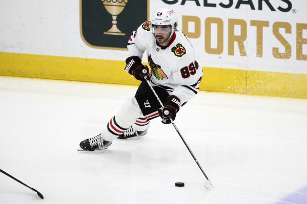 FILE - Chicago Blackhawks' Andreas Athanasiou skates with the puck during the third period of an NHL hockey game against the Washington Capitals, March 23, 2023, in Washington. The Blackhawks have locked in one of their top scorers, agreeing to a two-year, $8.5 million contract with Athanasiou. (AP Photo/Nick Wass, File)