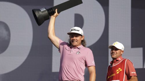 Rippers GC's Cameron Smith lifts the trophy following day three of the LIV Golf League at the Centurion Club, in Hertfordshire, England, Sunday July 9, 2023. (George Tewkesbury/PA via AP)