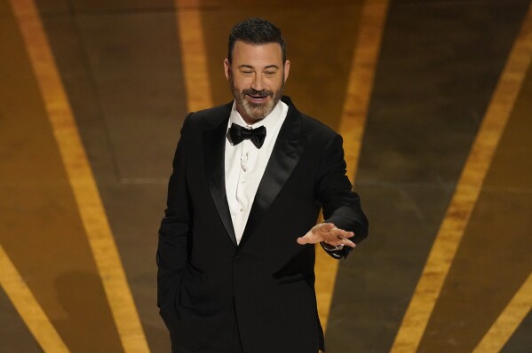 FILE - Host Jimmy Kimmel speaks at the Oscars, March 12, 2023, at the Dolby Theatre in Los Angeles. Former U.S. Rep. George Santos alleged in a lawsuit in New York, Saturday, Feb. 17, 2024, that late-night host Kimmel deceived him into making videos on the Cameo app that were used to ridicule the disgraced lawmaker on the show. (AP Photo/Chris Pizzello, File)