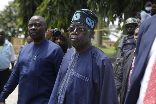 Bola Tinubu, centre , pays a visit at the St Francis Catholic Church following a gunmen attacked in Owo, Nigeria, Monday, June 6, 2022.  A former governor of Lagos, Nigeria’s largest city, has been nominated to be the ruling party’s presidential candidate in next year’s presidential election. Bola Tinubu, widely referred to as the “godfather” of Lagos because of his influence in the southwestern state which he governed from 1999 to 2007, polled a majority of the votes on Wednesday at the convention of the All Progressives Congress party. (AP Photo/Sunday Alamba)