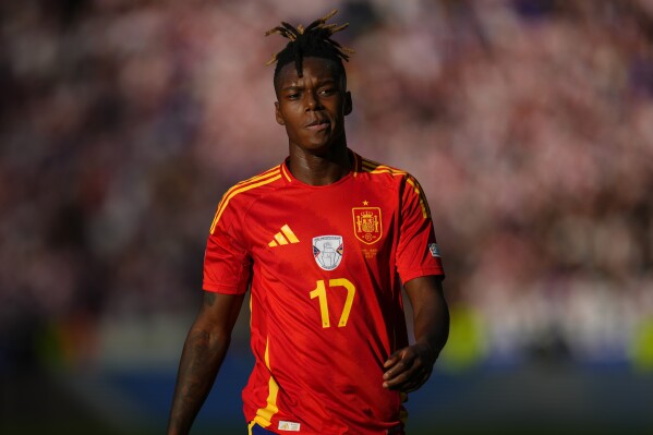 Spain's Nico Williams follows the action during a Group B match between Spain and Croatia at the Euro 2024 soccer tournament in Berlin, Germany, Saturday, June 15, 2024. Spain defeated Croatia 3-0. (AP Photo/Manu Fernandez)