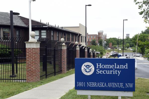 FILE - This June 5, 2015, file photo, shows a view of the Homeland Security Department headquarters in Washington. Less than a year after being on the verge of furloughing about 70% of employees to plug a funding shortfall, the federal agency that grants citizenship, green cards and temporary visas wants to improve service without a detailed plan to pay for it, including waivers for those who can't afford to pay fees, according to a proposal obtained by The Associated Press. (AP Photo/Susan Walsh, File)