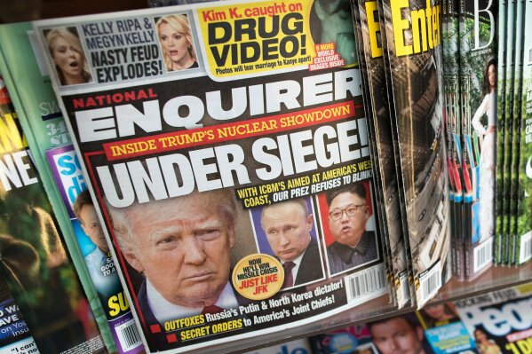 
              FILE - This July 12, 2017, file photo shows the cover of an issue of the National Enquirer featuring President Donald Trump at a store in New York. Confidential documents obtained by The Associated Press show that the National Enquirer's circulation declined even as it published stories attacking Trump's political foes and, prosecutors claim, helped suppress stories about his alleged sexual affairs. (AP Photo/Mary Altaffer, File)
            