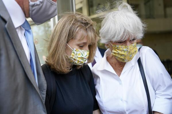 Allison Mack, center, leaves federal court with her mother Mindy Mack after being sentenced, Wednesday, June 30, 2021, in New York. The "Smallville" actor was sentenced to three years in prison for her role in the scandal-ridden, cult-like NXIVM group. (AP Photo/Mary Altaffer)