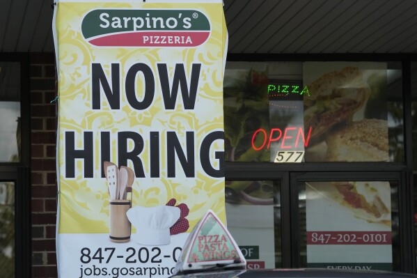 A hiring sign is displayed at a restaurant in Palatine, Ill., Wednesday, Sept. 13, 2023. On Thursday, the Labor Department reports on the number of people who applied for unemployment benefits last week. (AP Photo/Nam Y. Huh)