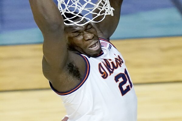 Illinois center Kofi Cockburn dunks the ball during the first half of a first round NCAA college basketball tournament game against Drexel Friday, March 19, 2021, at the Indiana Farmers Coliseum in Indianapolis .(AP Photo/Charles Rex Arbogast)