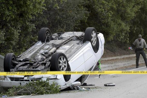 Ventura County Sheriff's Office personnel investigate the scene where a teenager was killed and three others injured after a stabbing suspect crashed his vehicle into the group as they were walking near their high school, in Thousand Oaks, Calif., Tuesday, April 18, 2023. (Juan Carlo/Ventura County Star via AP)