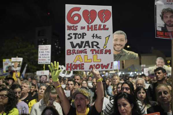 People attend a rally marking 600 days since Israelis were taken hostage by Hamas in Gaza, demanding their release and an end to the war, at a plaza known as the hostages square in Tel Aviv, Israel, Wednesday, May 28, 2025. (AP Photo/Leo Correa)