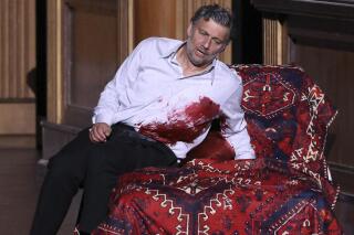 This image released by the Bavarian State Opera shows tenor Jonas Kaufmann as the mortally wounded Tristan during a rehearsal for his role debut in a new production of Wagner's "Tristan und Isolde," premiering at Munich's Bavarian State Opera on June 29. (Wilfried Hösl/Bavarian State Opera via AP)