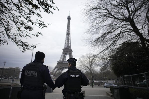 French policemen patrol near the Eiffel Tower after a man targeted passersbys late saturday, killing a German tourist with a knife and injuring two others in Paris, Sunday, Dec. 3, 2023. Police subdued the man, a 25-year-old French citizen who had spent four years in prison for a violent offense. After his arrest, he expressed anguish about Muslims dying, notably in the Palestinian territories. (APPhoto/Christophe Ena)