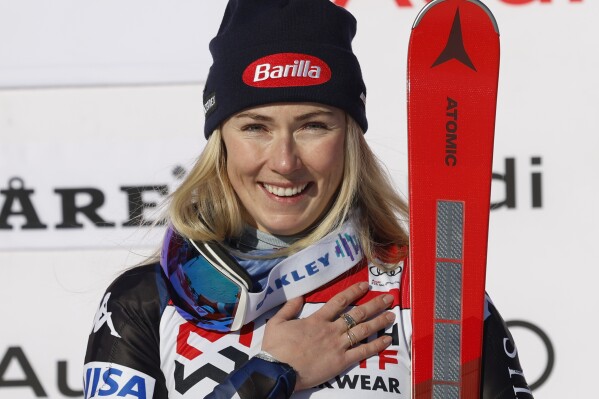 The winner United States' Mikaela Shiffrin celebrates after an alpine ski, women's World Cup slalom, in Are, Sweden, Sunday, March 10, 2024. (AP Photo/Alessandro Trovati)