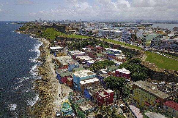 FILE - The coastal neighborhood of La Perla in San Juan, Puerto Rico, Aug. 25, 2017. The U.S. Department of Energy announced Thursday, Nov. 2, 2023, that it will disburse 0 million to install solar panels on low-income homes in Puerto Rico.  (AP Photo/Ricardo Arduengo, File)