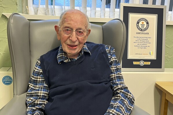 This is a handout photo issued by Guinness World records on Saturday, April 6, 2024 of John Alfred Tinniswood. The world’s oldest man says the secret to a long life is luck, regular exercise - and fish and chips every Friday. Englishman John Alfred Tinniswood, 111, has been confirmed as the new holder of the title by Guinness World Records. It follows the death of the Venezuelan record-holder, Juan Vicente Perez, this month at the age of 114. (Guinness World Records via AP)