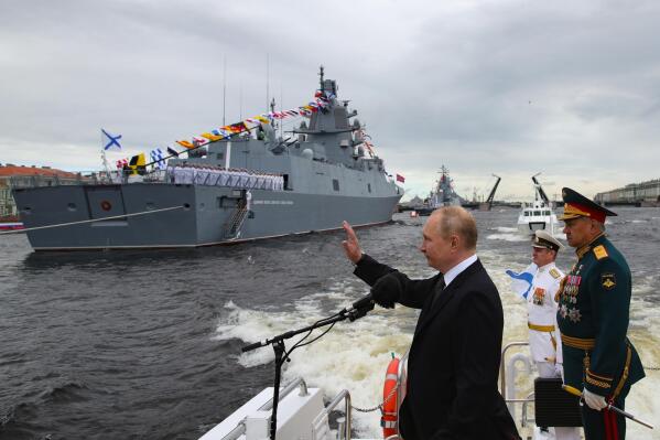 Russian President Vladimir Putin, center, and Defense Minister Sergei Shoigu, right, review warships before the main naval parade marking Russian Navy Day in the Gulf of Finland, at St. Petersburg, Russia, on Sunday, July 31, 2022. Putin sent Russian forces into Ukraine on Feb. 24, 2022, and appears determined to prevail -- ruthlessly and at all costs. (Mikhail Klimentyev, Sputnik, Kremlin Pool Photo via AP, File)