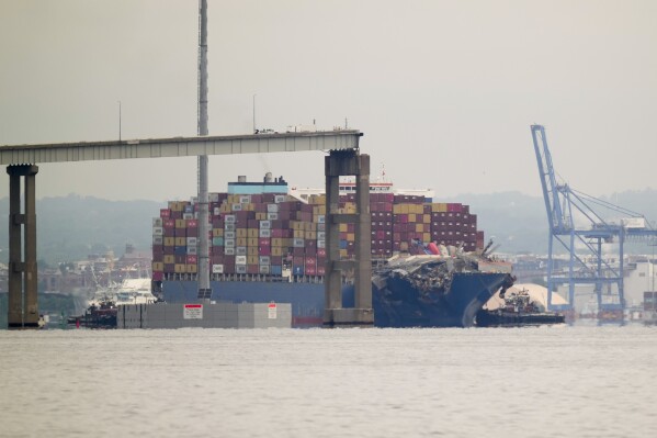 Tugboats escort the cargo ship Dali after it was refloated in Baltimore, Monday, May 20, 2024. (AP Photo/Matt Rourke, File)