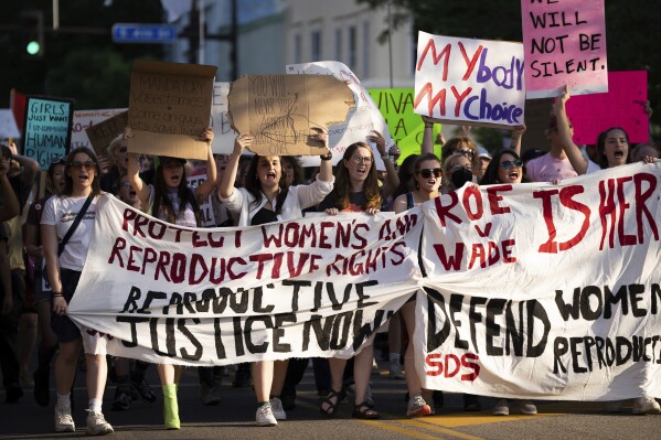 FILE - A large crowd marches on Cedar Avenue to downtown during a University of Minnesota student-led protest in Minneapolis, Minn., after the Supreme Court overruled Roe v. Wade on June 24, 2022. The Minnesota Court of Appeals ruled Monday, March 18, 2024, that a pharmacist who refused to provide emergency contraceptives to a customer because of his personal beliefs engaged in discrimination. (Renée Jones Schneider/Star Tribune via AP, File)