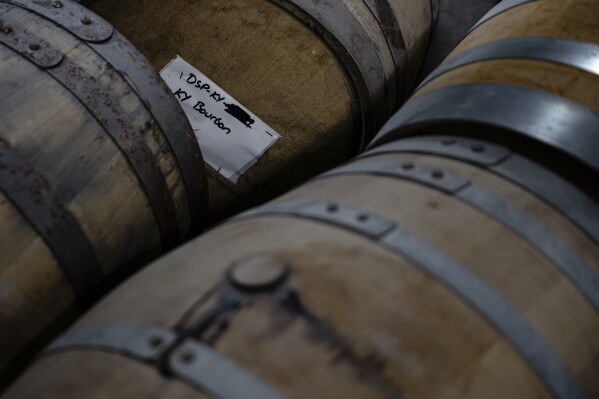 Bourbon barrels with product in them are seen inside of the Brough Brothers Distillery that is under construction in Louisville, Ky., Saturday, March 8, 2025. (AP Photo/Jon Cherry)