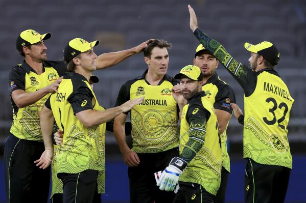 Pat Cummins, centre, of Australia is congratulated by teammates after dismissing Kusal Mendis of Sri Lanka during the T20 World Cup cricket match between Australia and Sri Lanka in Perth, Australia, Tuesday, Oct. 25, 2022. (Richard Wainwright/AAPImage via AP)