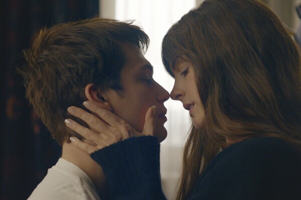 This image released by Prime shows Nicholas Galitzine, left, and Anne Hathaway in a scene from "The Idea of You." (Prime via AP)