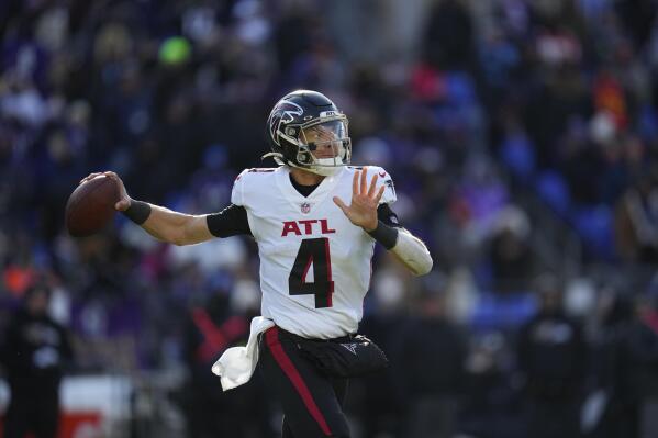 Atlanta Falcons quarterback Desmond Ridder (4) drops back to pass during the first half of an NFL football game against the Baltimore Ravens, Saturday, Dec. 24, 2022, in Baltimore. (AP Photo/Julio Cortez)