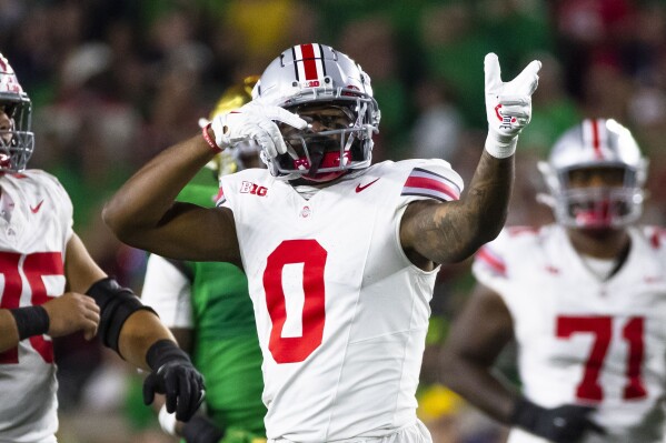 Ohio State wide receiver Xavier Johnson celebrates a first down during the second half of the team's NCAA college football game against Notre Dame on Saturday, Sept. 23, 2023, in South Bend, Ind. (AP Photo/Michael Caterina)