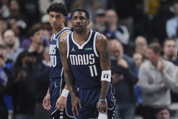 Kyrie Irving has a torn ACL and is out for the season | AP News