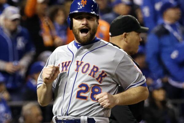 FILE - New York Mets' Daniel Murphy reacts as he scores from second on a hit by Lucas Duda during the fourth inning of Game 2 of baseball's World Series against the Kansas City Royals on, Oct. 28, 2015, in Kansas City, Mo.  The Mets announced Tuesday, Feb. 8, 2022,  the return of Old-Timers Day for the first time since 1994.  (AP Photo/David J. Phillip, File)