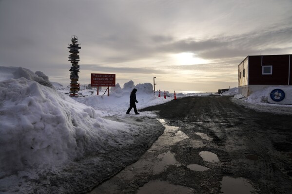 A woman walks outside Chile's Eduardo Frei Air Force Base at King George Island, South Shetlands, Antarctica, Nov. 25, 2023. (AP Photo/Jorge Saenz)